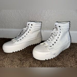 White combat sneaker. Never worn, but slight discoloration.